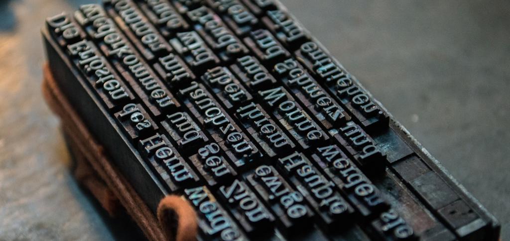 Blocks of movable metal type set in a composing stick